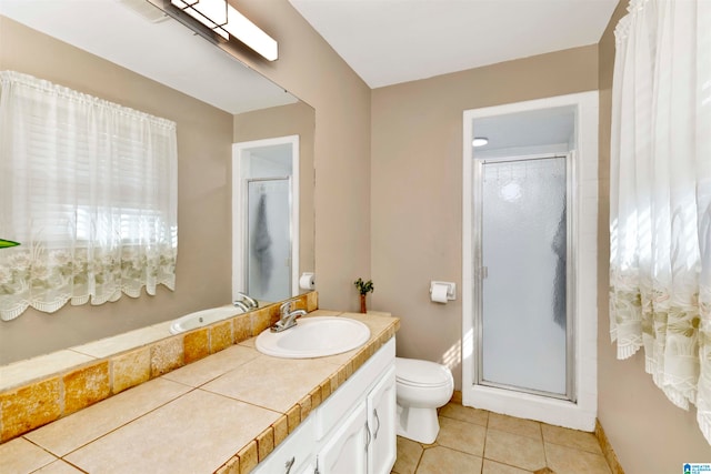 bathroom featuring walk in shower, vanity, toilet, and a wealth of natural light