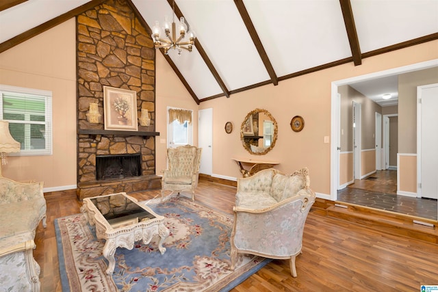 living room featuring beamed ceiling, high vaulted ceiling, a notable chandelier, a fireplace, and hardwood / wood-style floors