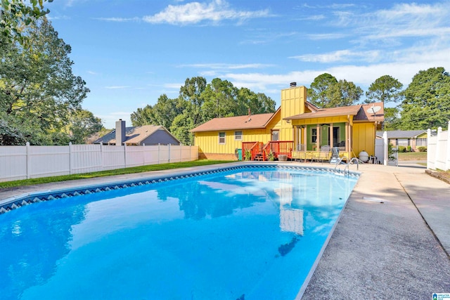 view of swimming pool featuring a patio