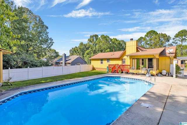 view of swimming pool with a patio area