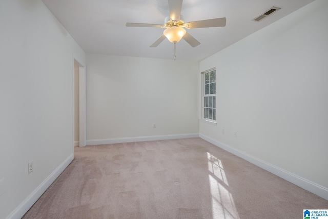 carpeted empty room with ceiling fan