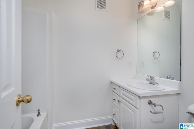 bathroom featuring vanity and a bathing tub