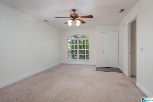 carpeted empty room with ceiling fan