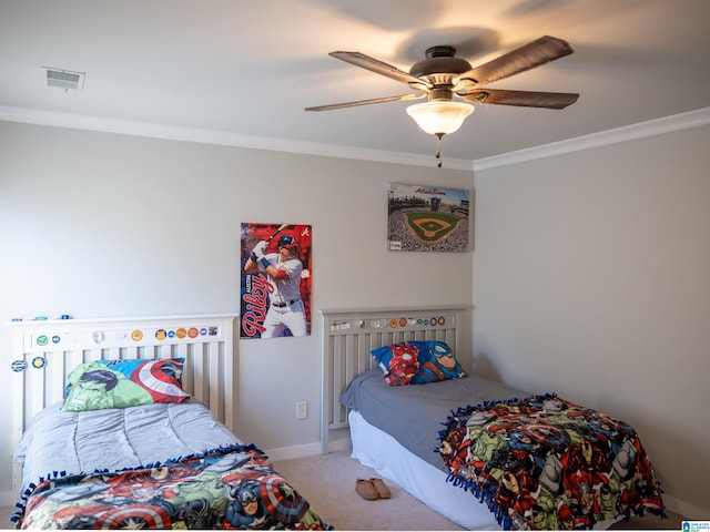 bedroom with ceiling fan, carpet floors, and crown molding