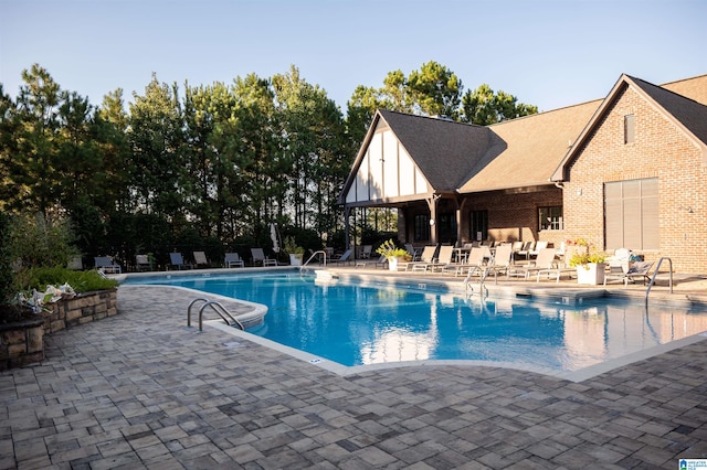 view of pool featuring a patio area