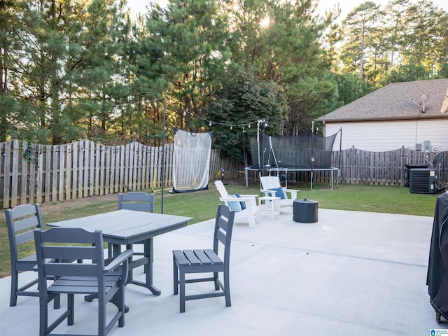 view of patio with cooling unit and a trampoline