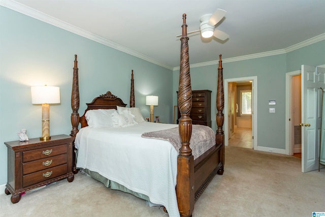 carpeted bedroom featuring ornamental molding and ceiling fan