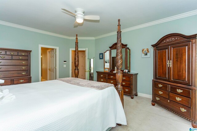 bedroom featuring crown molding, ceiling fan, and light colored carpet