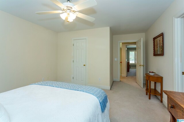 carpeted bedroom featuring ceiling fan