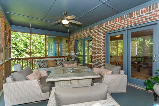 sunroom / solarium with ceiling fan