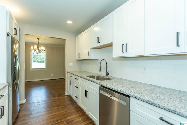 kitchen featuring sink, dark wood-type flooring, white cabinetry, appliances with stainless steel finishes, and light stone countertops