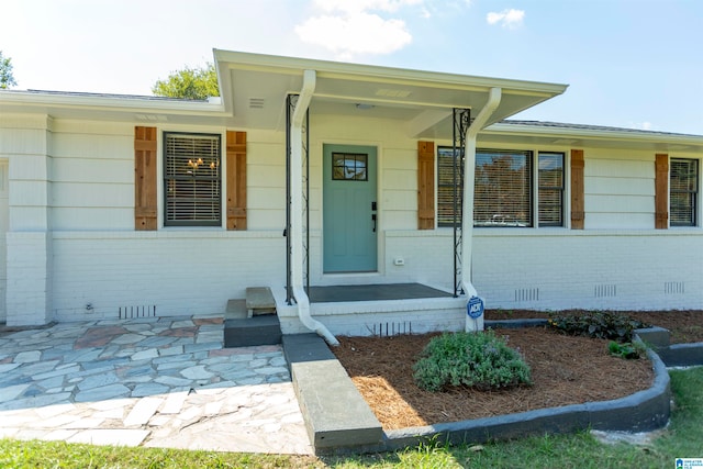 doorway to property with a porch