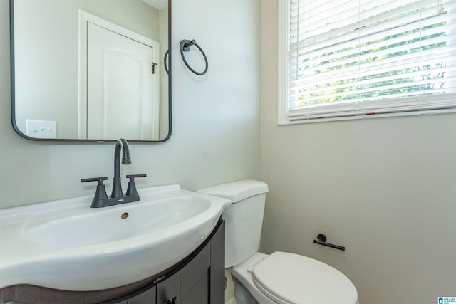 bathroom with vanity and toilet