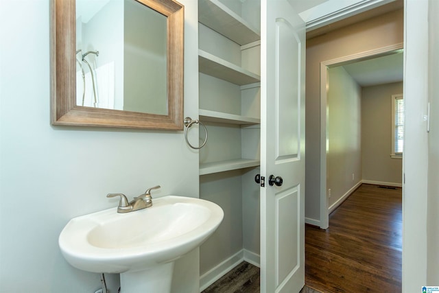 bathroom featuring sink and hardwood / wood-style floors