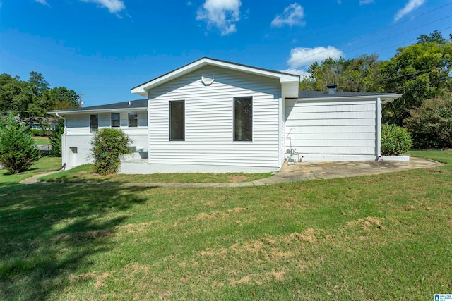 rear view of house with a yard