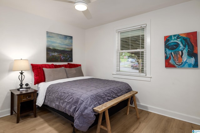 bedroom featuring wood-type flooring and ceiling fan