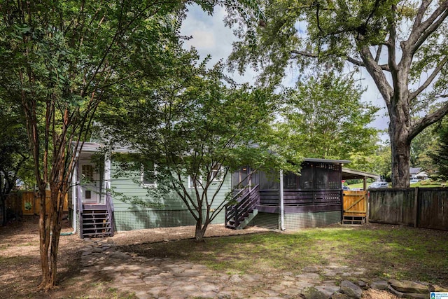 view of yard featuring a sunroom