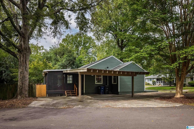 view of front of property featuring a carport