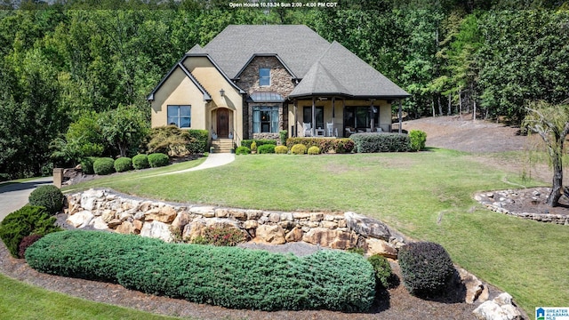 view of front facade with a porch and a front yard