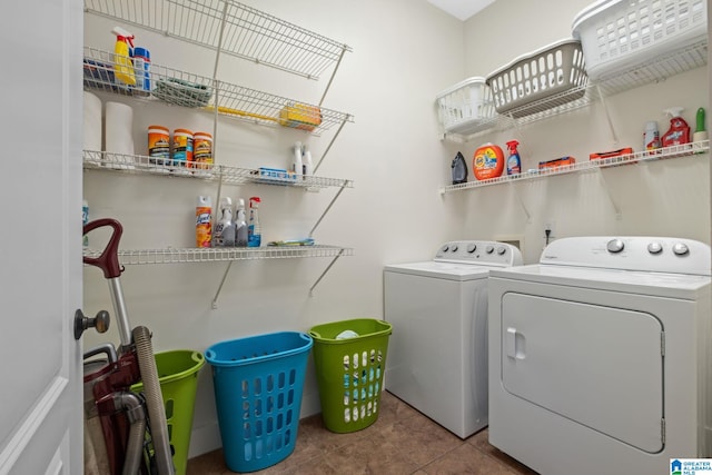 laundry area featuring tile patterned floors and separate washer and dryer