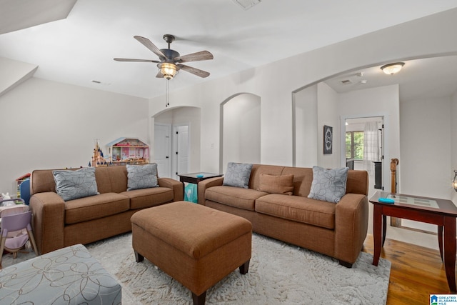 living room with ceiling fan and light hardwood / wood-style floors