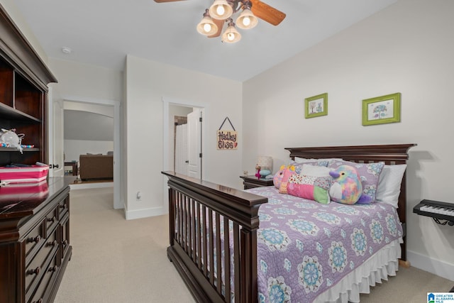 bedroom with ceiling fan and light carpet