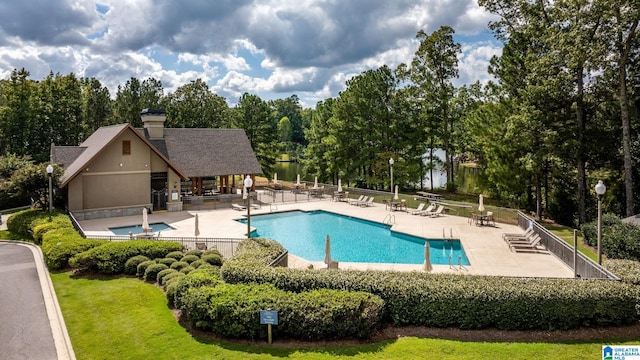 view of swimming pool featuring a patio area