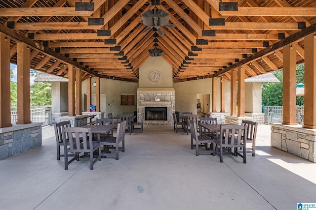 view of patio with an outdoor stone fireplace