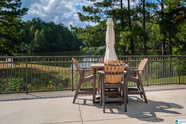 view of patio with a water view