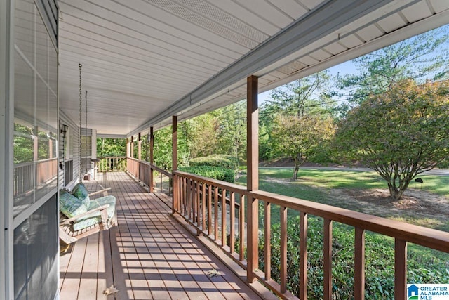 wooden terrace featuring covered porch