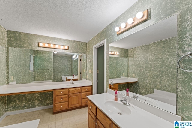 bathroom with vanity and a textured ceiling