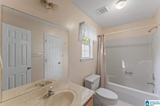 full bathroom featuring vanity, shower / bath combination with curtain, a textured ceiling, and toilet