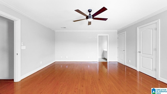 interior space with crown molding, hardwood / wood-style flooring, and ceiling fan