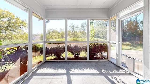 unfurnished sunroom featuring plenty of natural light