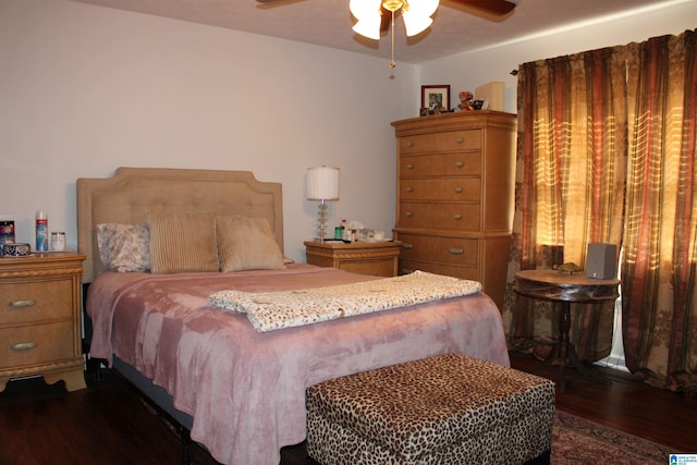 bedroom featuring ceiling fan and dark hardwood / wood-style flooring