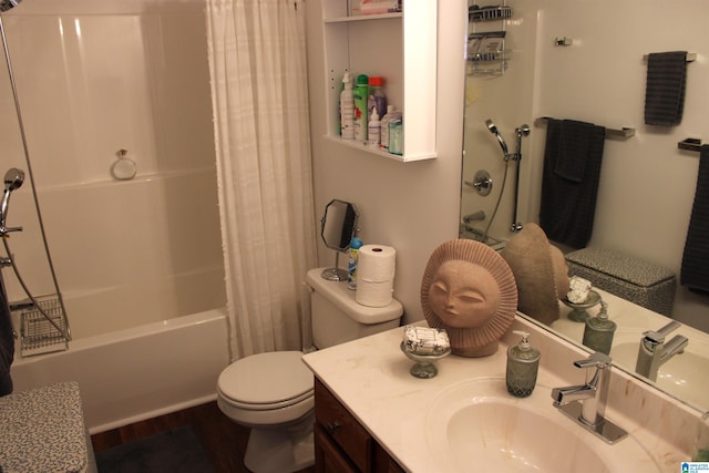 full bathroom featuring hardwood / wood-style floors, vanity, shower / tub combo, and toilet