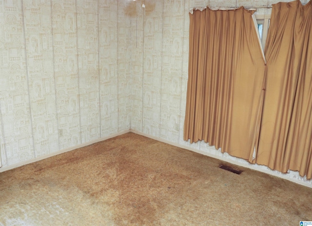 spare room featuring carpet flooring