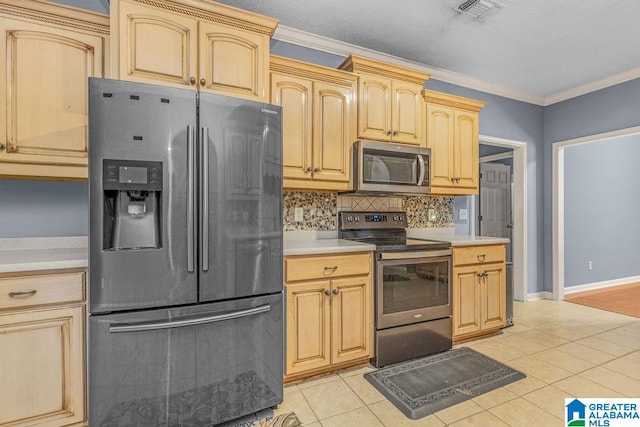 kitchen with stainless steel appliances, light brown cabinetry, ornamental molding, and light tile patterned floors