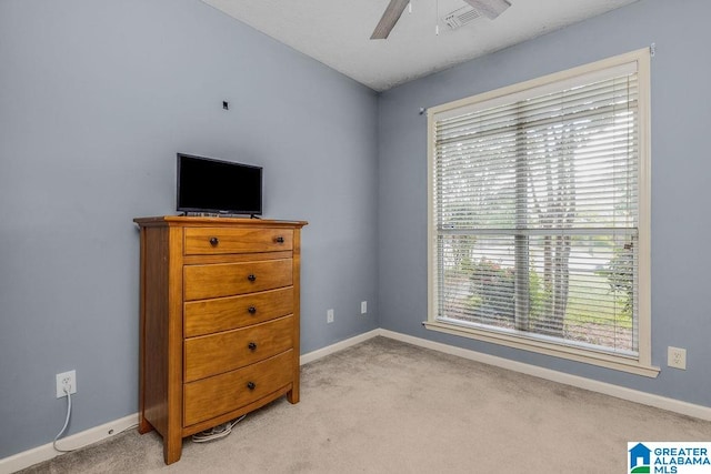 carpeted bedroom featuring ceiling fan