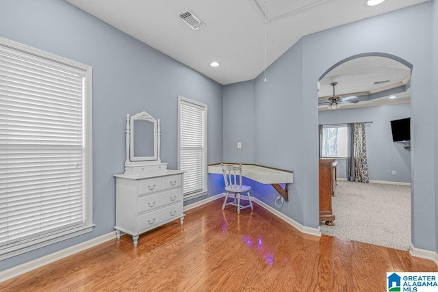 misc room with ceiling fan and light hardwood / wood-style floors