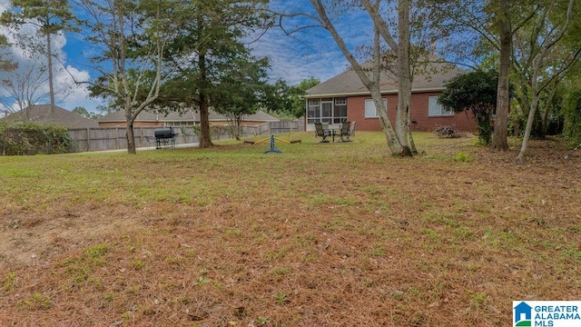 view of yard featuring a sunroom