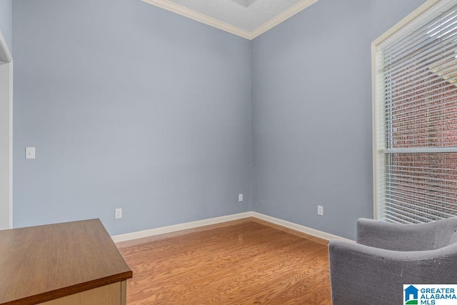 unfurnished room featuring ornamental molding and hardwood / wood-style floors