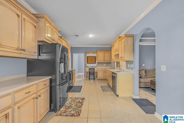 kitchen featuring appliances with stainless steel finishes, light brown cabinetry, crown molding, and light tile patterned flooring