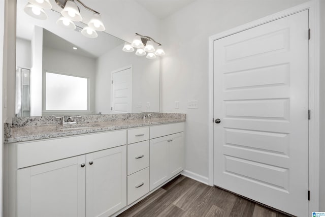 bathroom featuring vanity and wood-type flooring