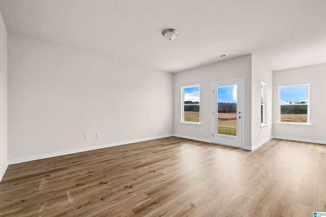 empty room featuring wood-type flooring