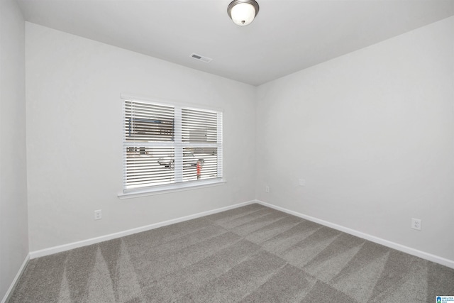 unfurnished room featuring carpet