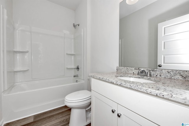 full bathroom featuring vanity, toilet, shower / bath combination, and hardwood / wood-style floors