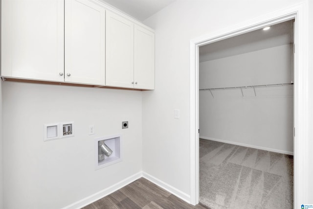 washroom featuring washer hookup, dark wood-type flooring, cabinets, and hookup for an electric dryer