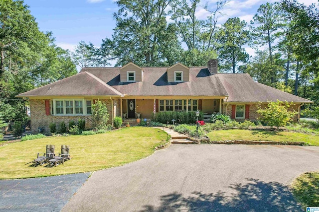 new england style home with a front lawn