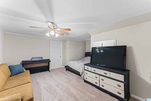 bedroom with light carpet, crown molding, and ceiling fan